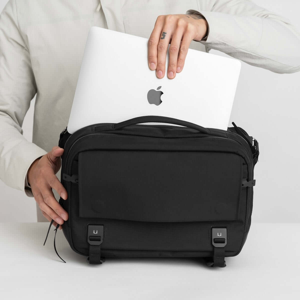 Black Ember Grip Sling 12L backpack designed for urban mobility and durable everyday carry