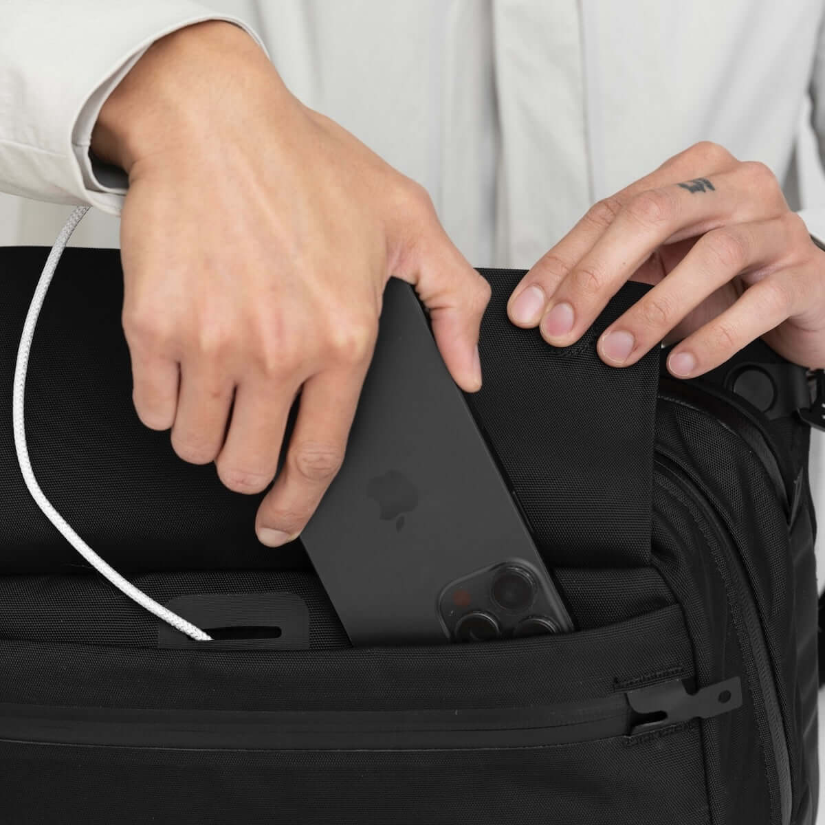 Black Ember Grip Sling 12L backpack designed for urban mobility and durable everyday carry