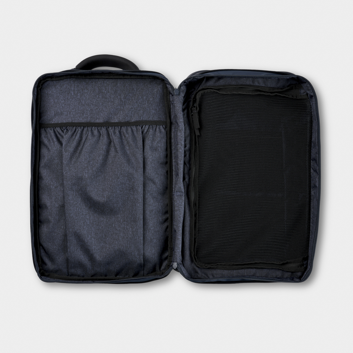 Open Nomatic Travel Pack showing organized interior with mesh zippered compartment and elastic storage sleeves, ideal for tech and travel gear.