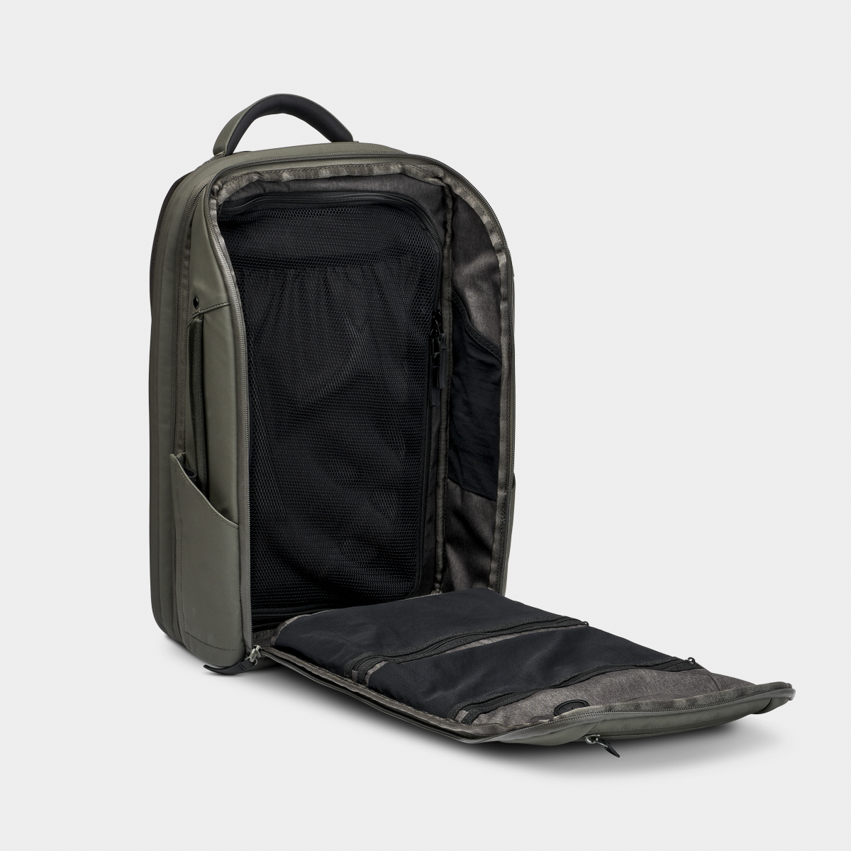 Nomatic Travel Pack backpack in olive green, shown open to reveal organized compartments and expandable storage for 14 to 20 liters capacity.