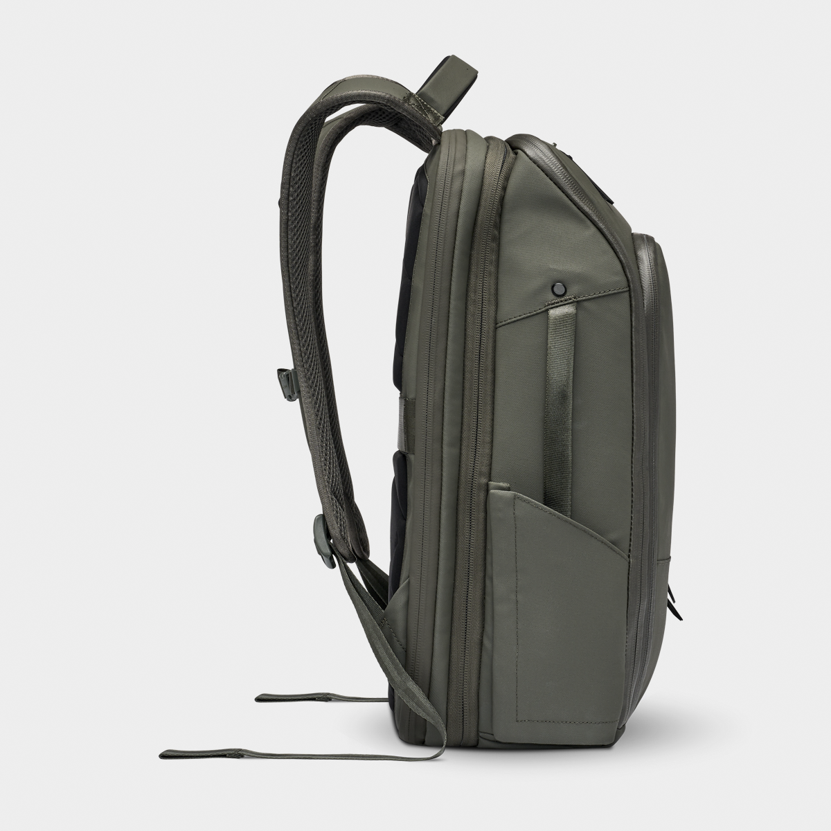Side view of the Nomatic Travel Pack backpack in olive green, showcasing expandable compartments and weather-resistant fabric for travel organization.