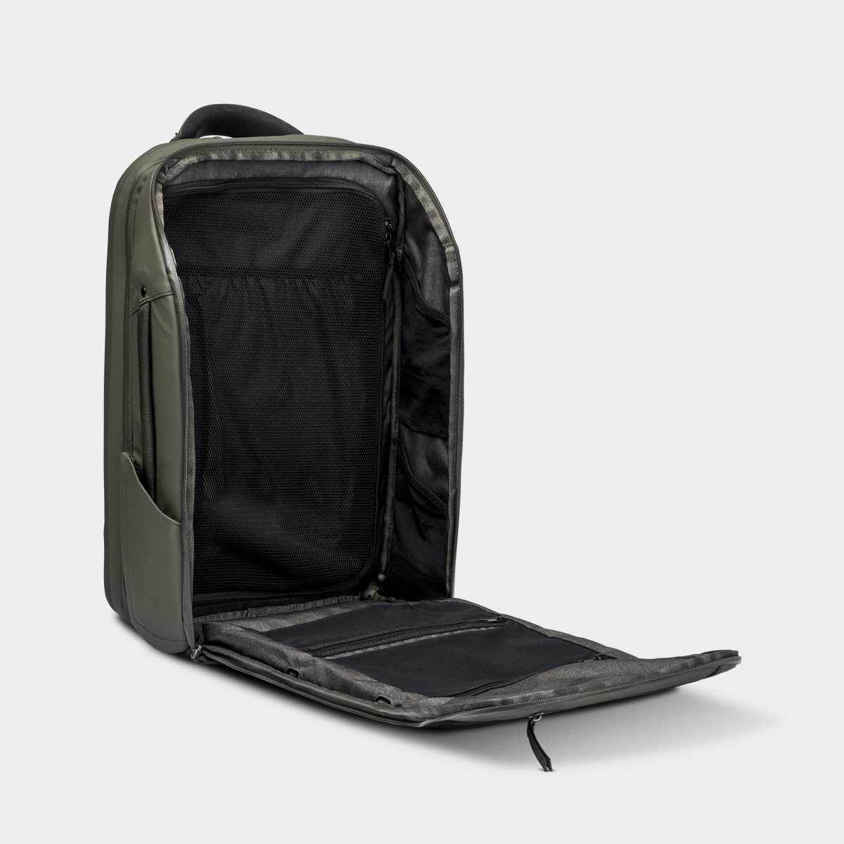 Nomatic Travel Pack backpack in olive green, shown open to reveal expandable interior, mesh compartments, and organized storage pockets.