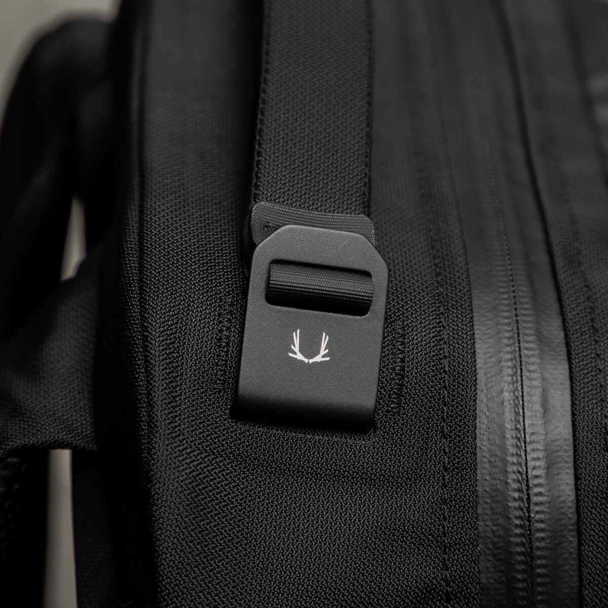 Black Ember CITADEL 20L backpack, a sleek and weatherproof EDC travel backpack in matte black.
