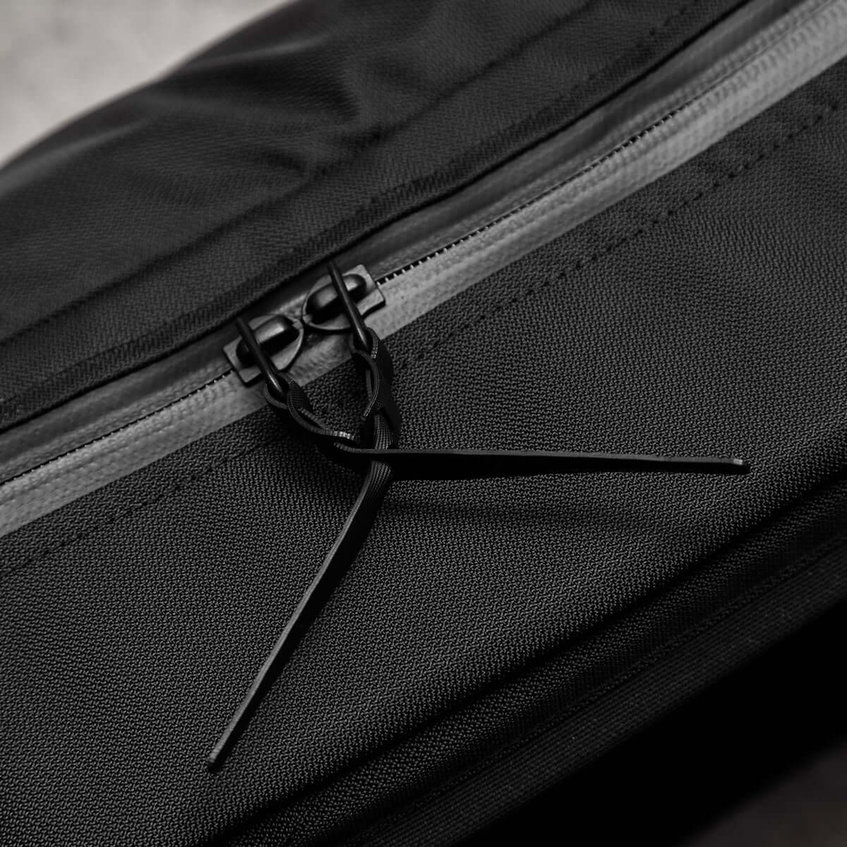 Black Ember CITADEL 20L backpack, a sleek and weatherproof EDC travel backpack in matte black.