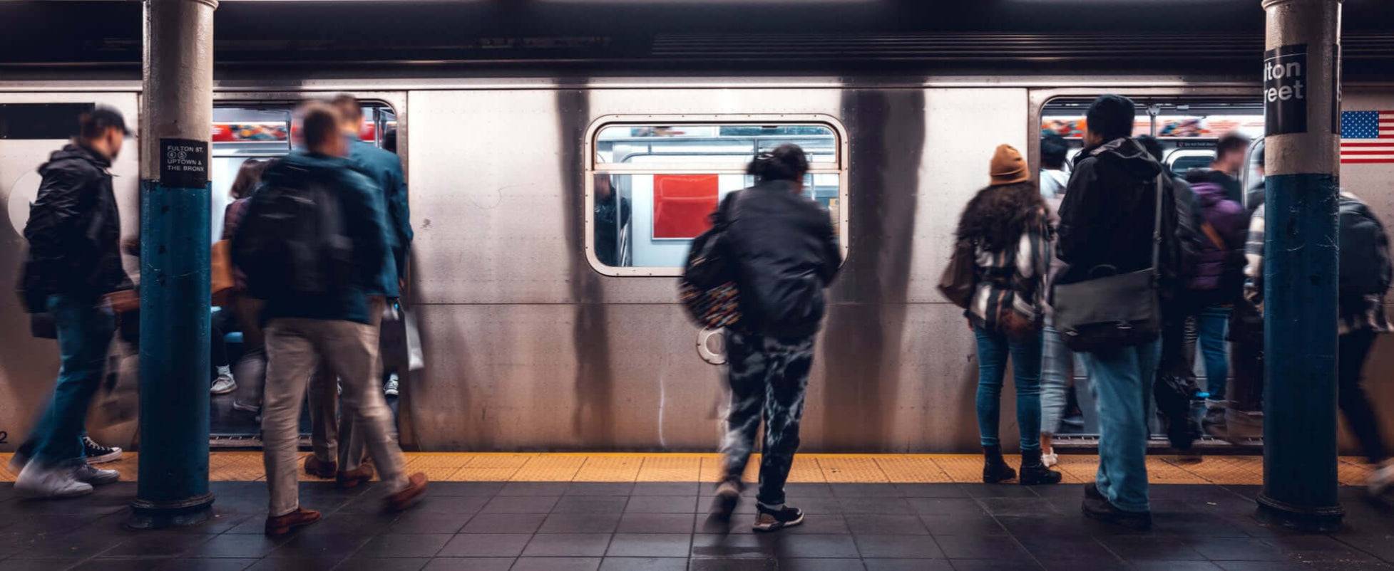 backpack commuters in subway station