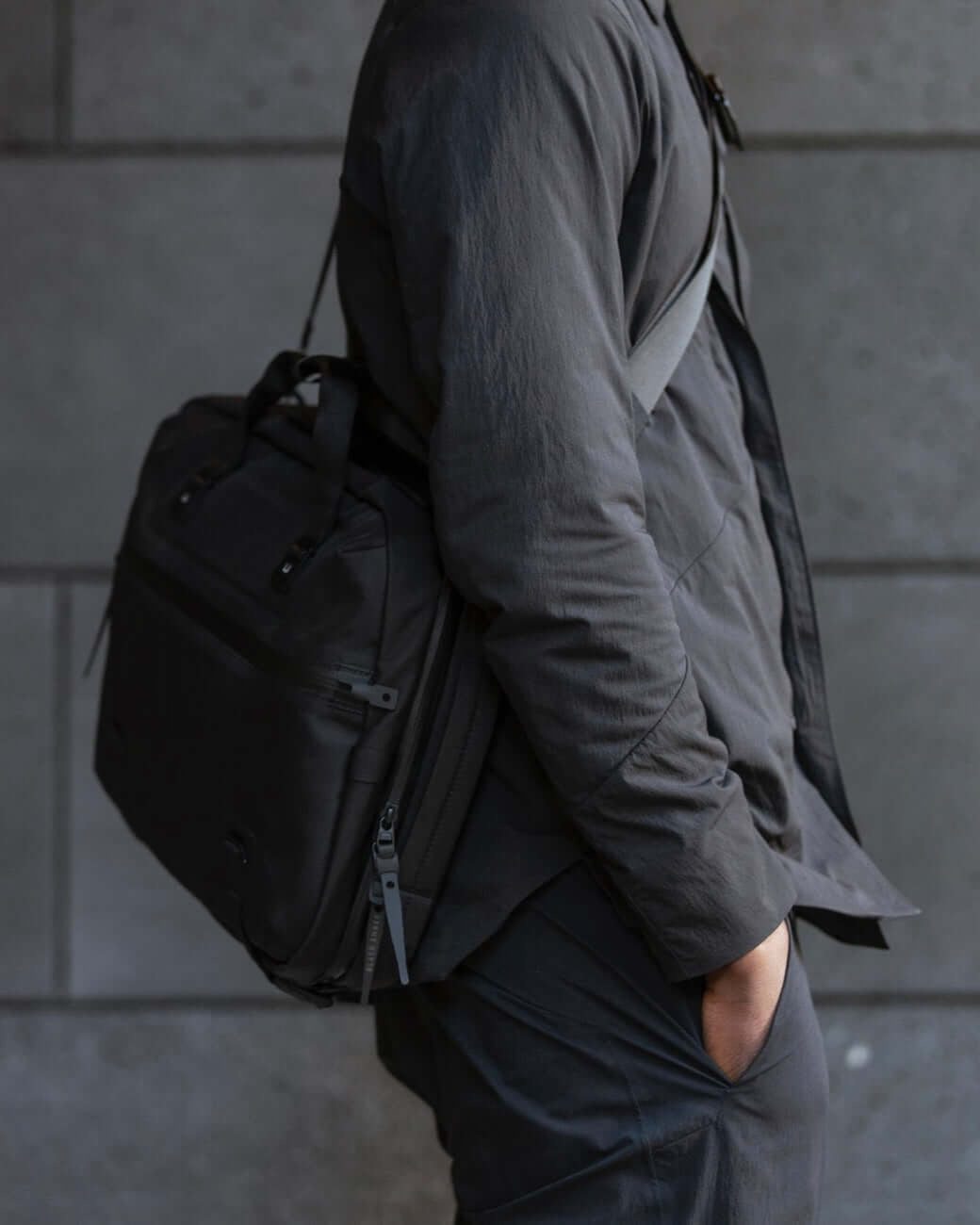 Black Ember FORGE SB 20L Minimalist Soft Brief worn crossbody, showcasing sleek design and compact storage for everyday carry.