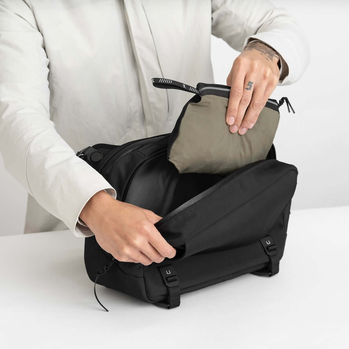 Black Ember Grip Sling 12L backpack designed for urban mobility and durable everyday carry