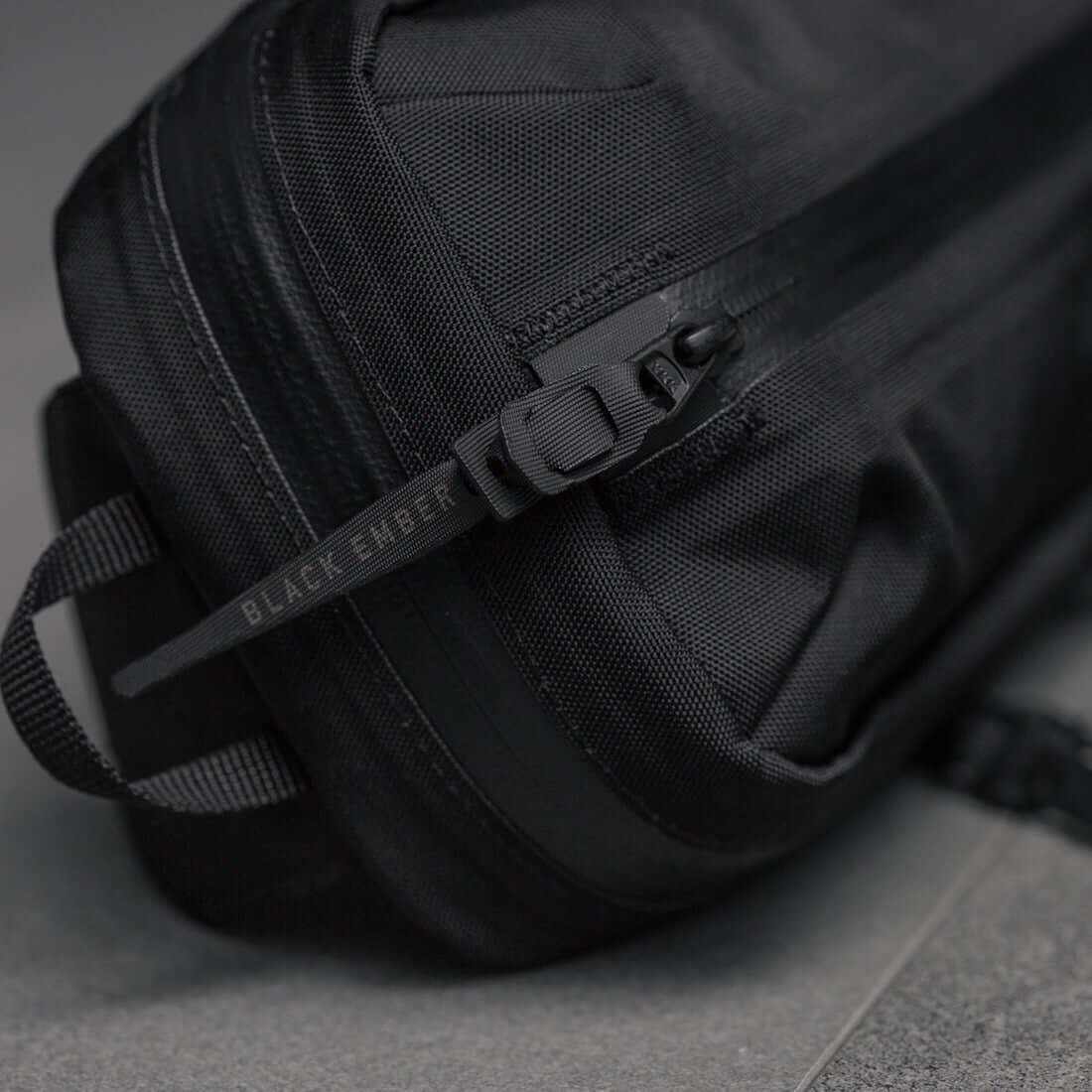 Black Ember TKS Sling bag showcasing sleek design and durable materials for urban carry solutions.