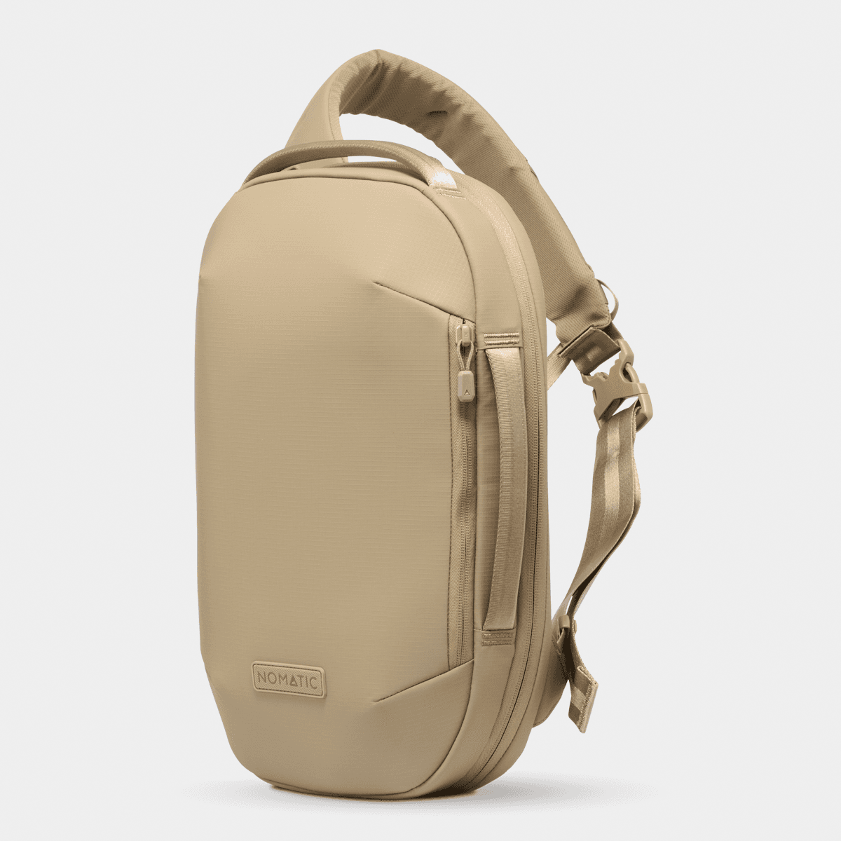 Nomatic Navigator RS Sling 10L in beige, minimalist design with padded compartment for laptops and versatile storage.